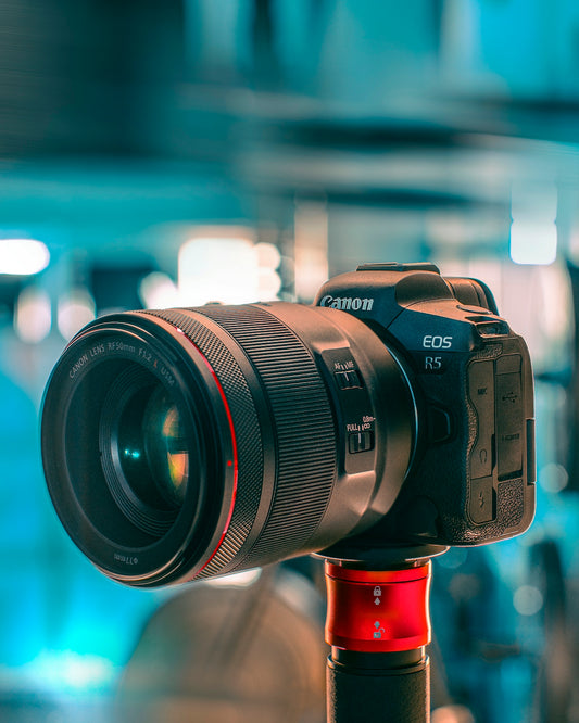 black nikon dslr camera on red stand
