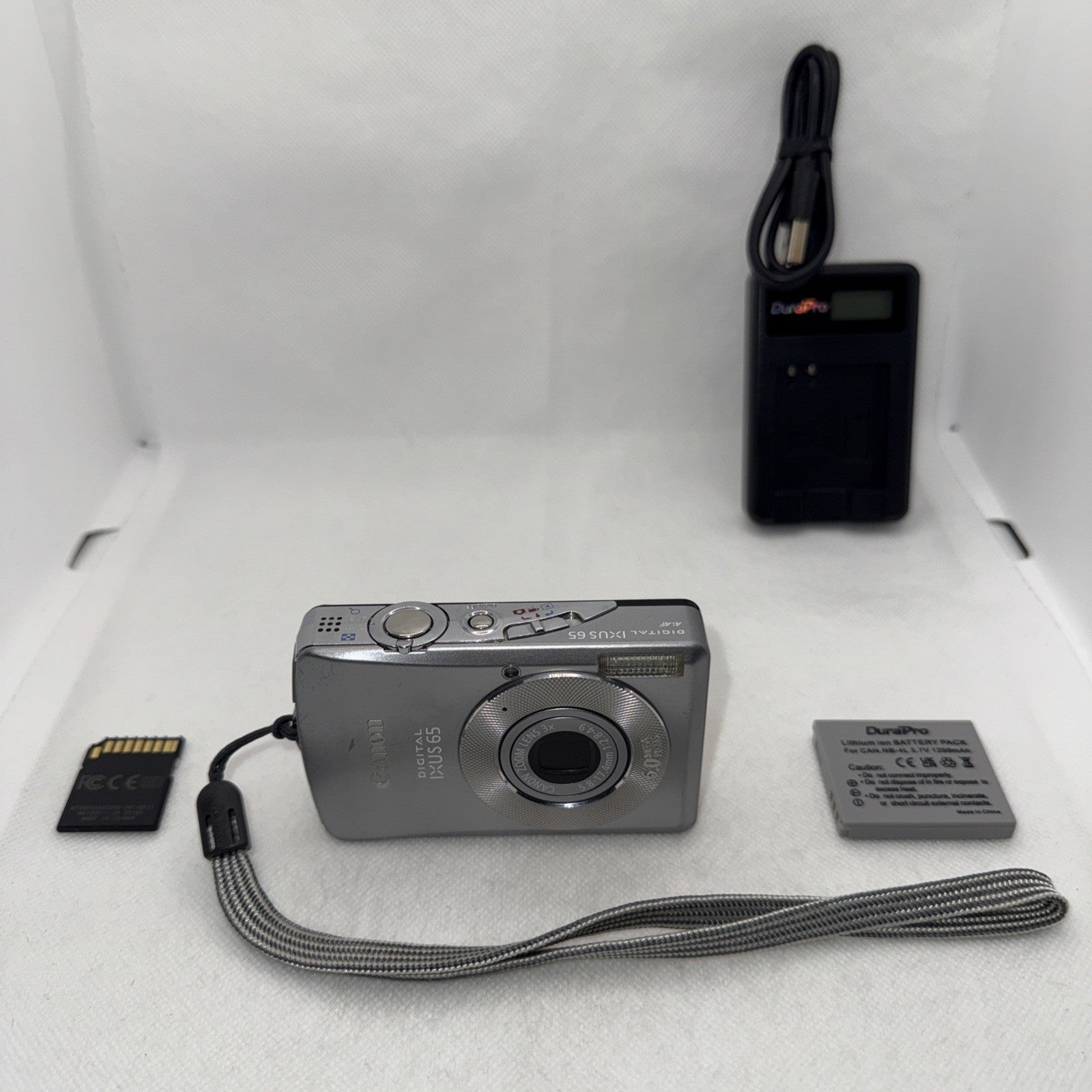 Canon IXUS 65 6.0MP Digital Camera Tested Plus Charger Battery 2GB SD Card0